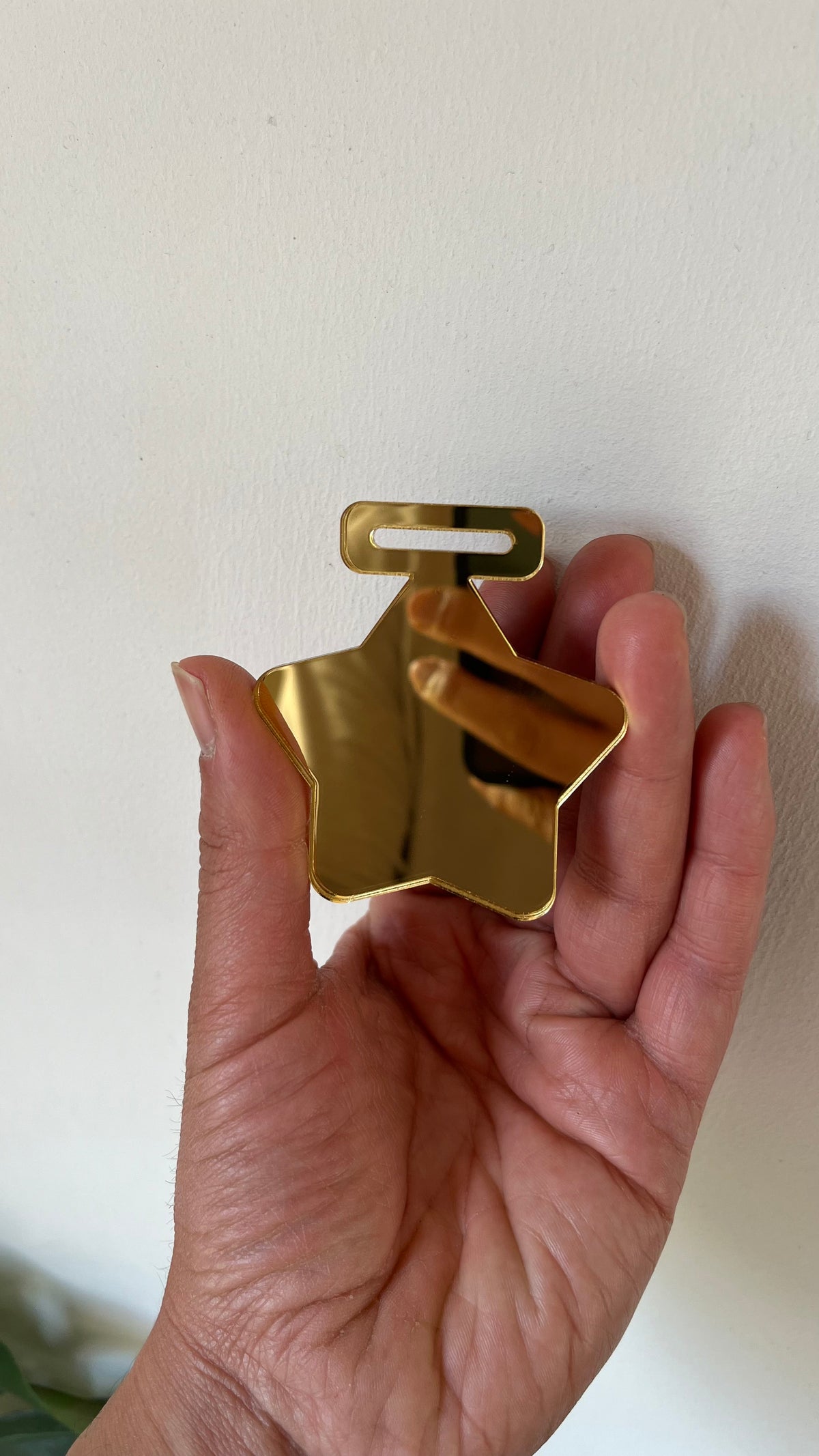 Medalla dorado espejo